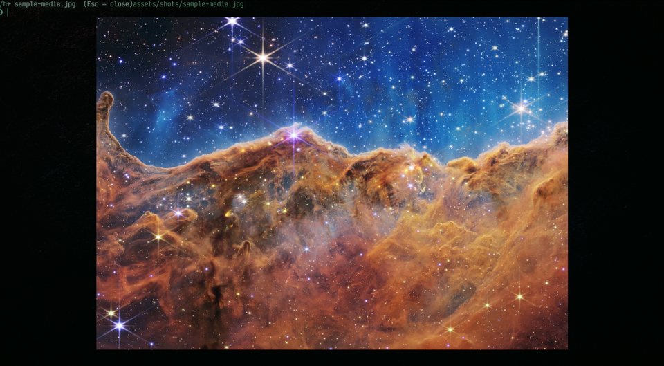 OdyTTY's image lightbox displaying the JWST Cosmic Cliffs nebula photograph inside the terminal.